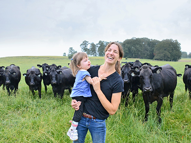 Jamie Blythe, with daughter Gracie, raises cattle in addition to cotton and corn crops in northern Alabama.(Progressive Farmer photo by Brent Warren)